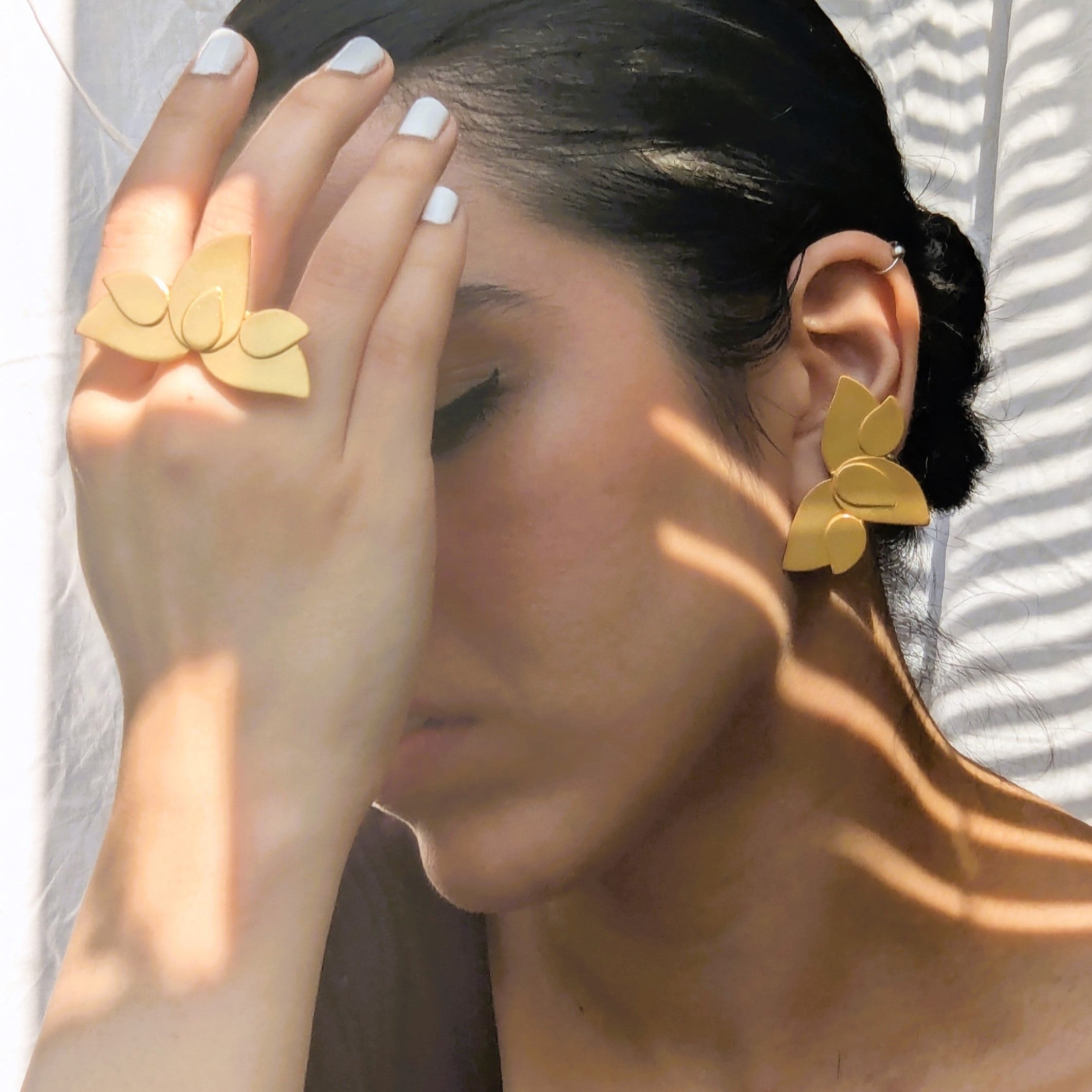 Statement gold earrings and statement gold ring